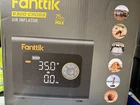 Fanttik S300 Cross Portable Air Inflator 75 Psi With Multiple Valve Adapters Open. Price: $35.00.