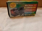 Central Pneumatic 12-VOLT Mini Air Compressor, Light, Flasher. New-in-box. Price: $26.95.