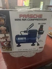 Paasche D500SR 1/5 Hp Oilless Compressor With Regulator And Moisture Trap - Blue New. Price: $85.00.