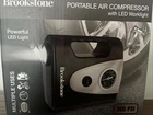 Brookstone Portable Air Compresson With Led Worklight Brand New Free Shipping!!. Price: $30.00.