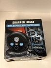 Sharper Image Tire Shaped 12V Car Air Compressor New In Box Open. Price: $20.00.