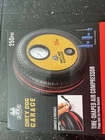 Garage By Nifty Portable Tire-shaped Air Compressor 7" Box 12V 250PSI New. Price: $20.00.