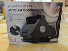 Auto Air Compressor Car Bike Tires Balls 12V Dc Plug In 120PSI Sharper Image Open. Price: $37.99.