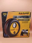 Garage By Nifty Portable Tire-shaped Air Compressor In 7" Box 12V 250PSI Open. Price: $25.00.