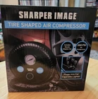 Sharper Image Shaped 12V Air Compressor For Roadside Inflation New. Price: $27.50.