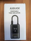 Jusuox Tire Inflator Portable Air Compressor, 150 Psi Cordless Pump Open. Price: $25.00.