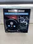 Sharper Image Tire Shaped Air Compressor New. Price: $30.00.