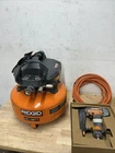 Ridgid 6 Gal. 150 Psi Electric Pancake Air Compressor W/18GA Brad Nailer & Hose Used. Price: $154.99.